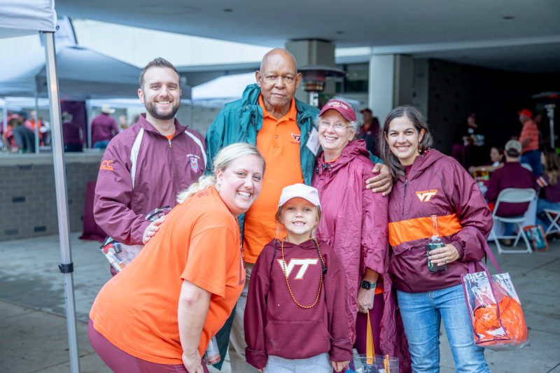 CALS alumni and friends posing at the 2022 CALS alumni tailgate