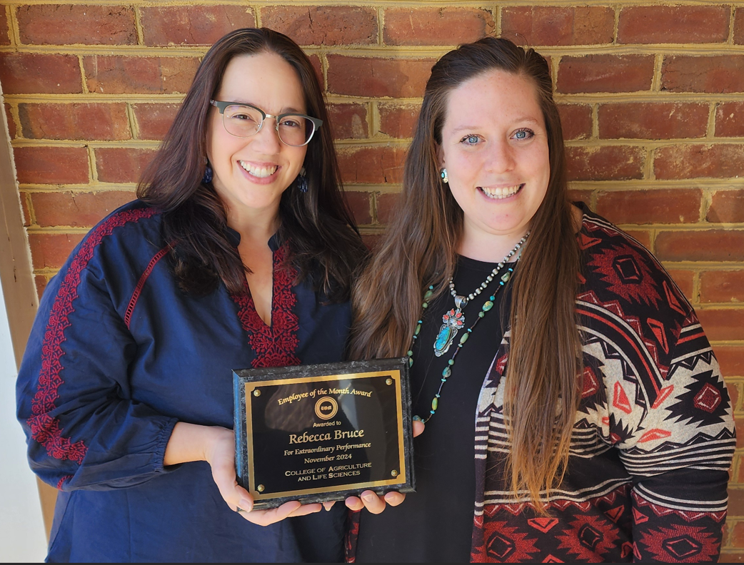 CALS employee of the month, Rebecca Bruce, receiving plaque