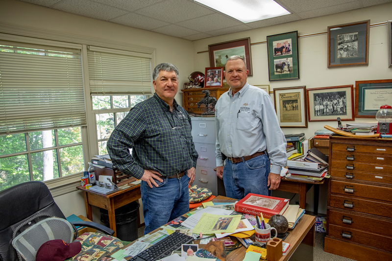 Two Saunders brothers in their office