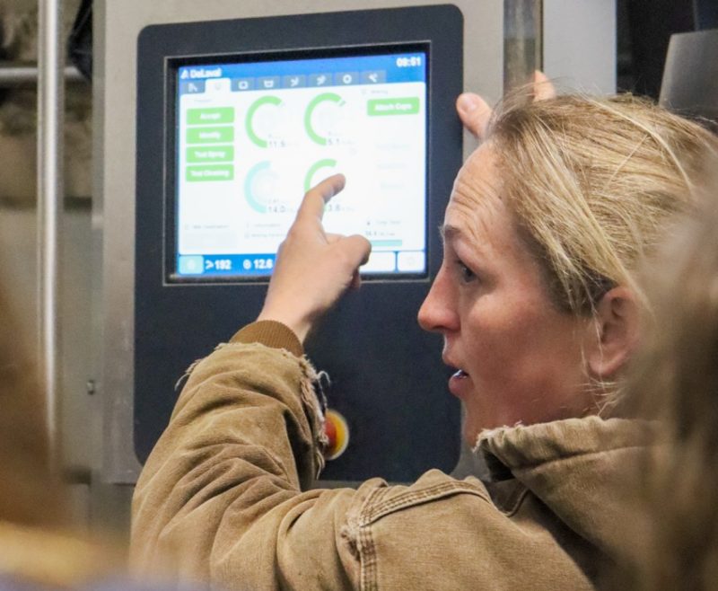 A student points to a monitor