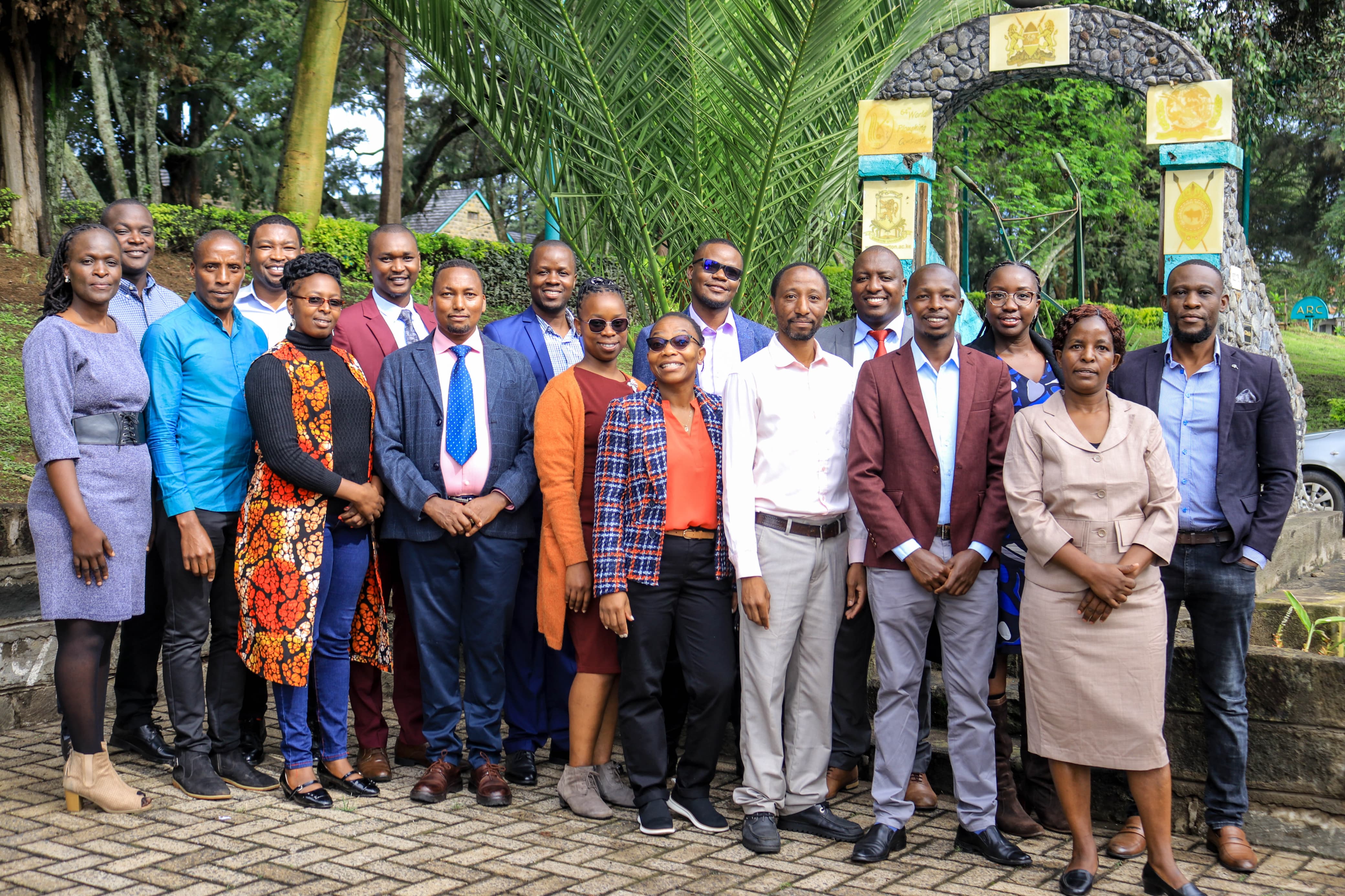 21 APECS fellows standing outside smiling