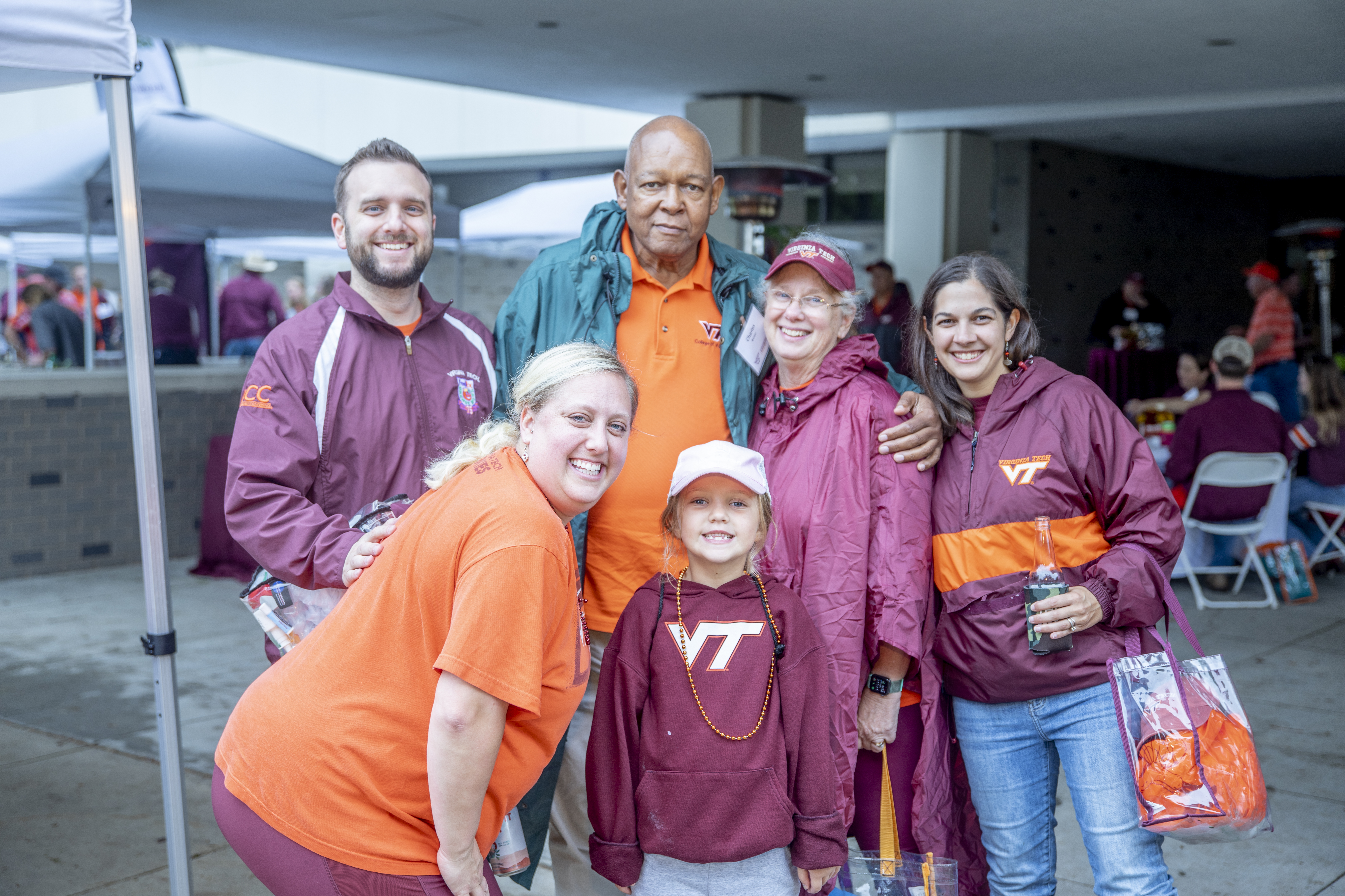 Alumni and friends pose together at a CALS tailgate