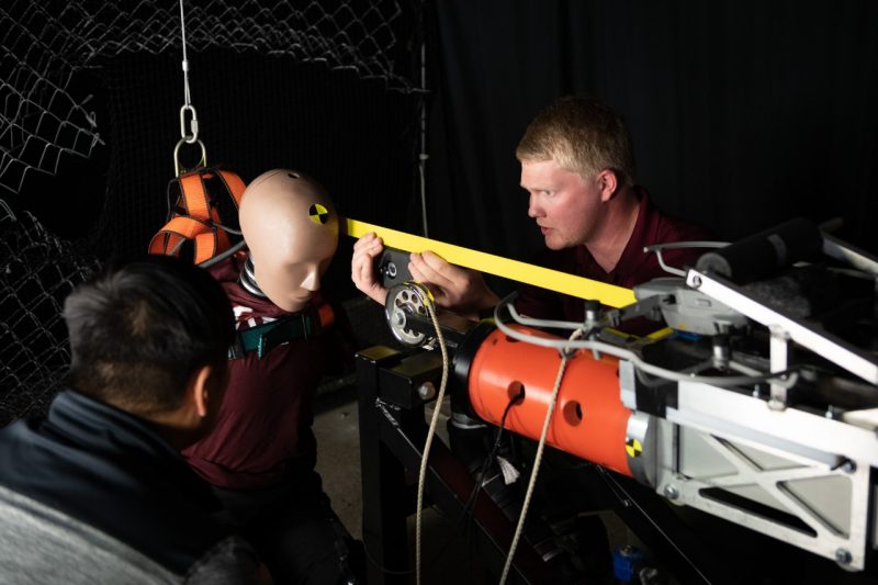 Researchers situate crash test dummy for impact testing