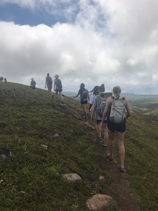 The students hike around El Junco in the highlands of San Cristóbal Island in the Galápagos Islands. Despite the name, it is a crater lake rather than a lagoon.