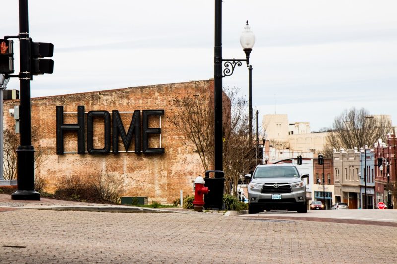 The words "HOME" on a building resurrected from a historic sign